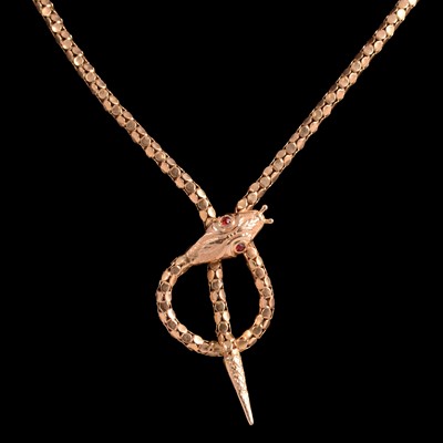 Lot 266 - A yellow snake design necklace.