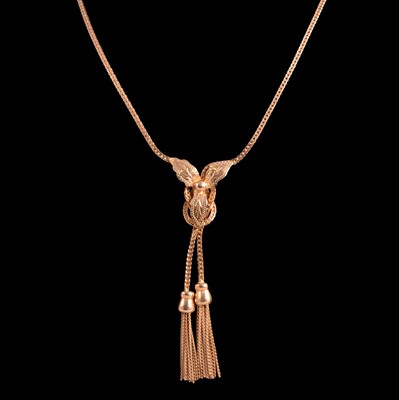 Lot 267 - UnoAErre - a yellow metal tassel necklace.