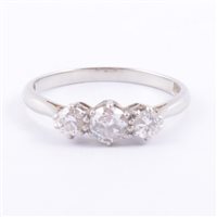 Lot 169 - A diamond three stone ring, the brilliant cut...