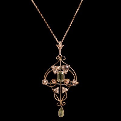 Lot 243A - A peridot and seed pearl pendant brooch on a chain.
