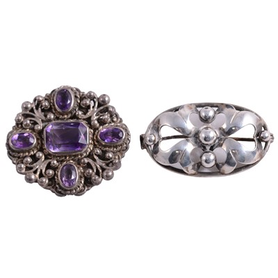 Lot 467 - An amethyst brooch, and John Lauritzen - a silver modernist brooch.