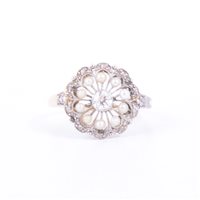 Lot 179 - A pearl and diamond circular cluster ring, a...