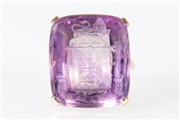 Lot 180 - An amethyst intaglio seal ring, the...