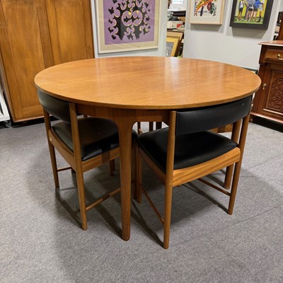 Lot 155 - Mid-century teak extending 'Roundette' dining table and four chairs, by McIntosh