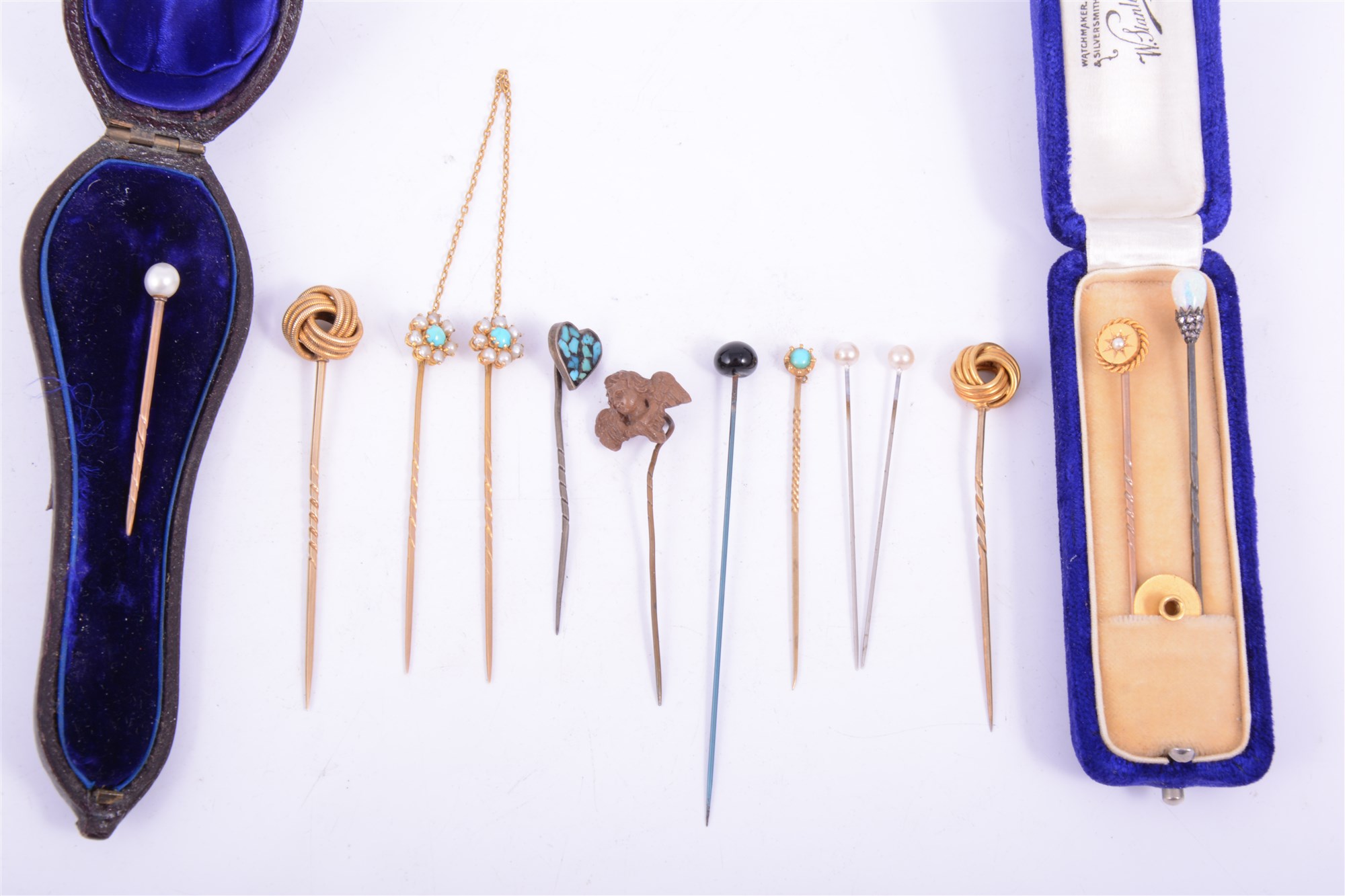 Lot 196 Thirteen Victorian/Edwardian stick pins, a