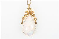 Lot 197 - An opal and diamond pendant and chain, the...