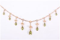 Lot 199 - A peridot and seed pearl necklace, nine pearl...