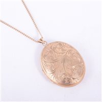 Lot 204 - A 9 carat yellow gold oval locket and chain,...