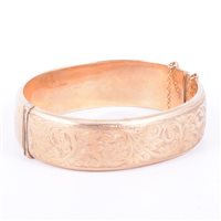 Lot 211 - A 9 carat yellow gold Victorian style bangle,...