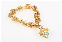 Lot 214 - A yellow metal marine link bracelet with fob,...