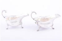 Lot 141 - Pair of George III style silver sauceboats,...