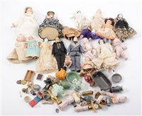 Lot 1397 - Collection of miniature dolls; along with a...