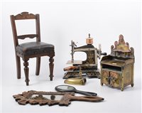 Lot 1398 - Victorian childs toy sewing machine, leather...