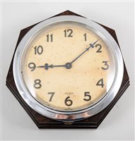 Lot 540 - A Bakelite cased wall clock, by Bayard,...