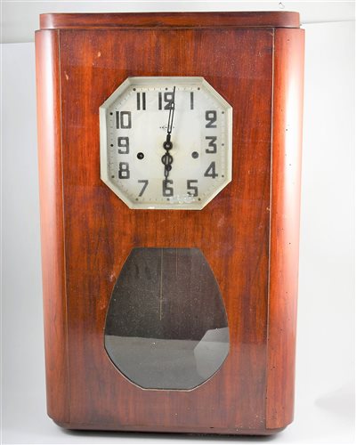 Lot 541 - An Art Deco walnut cased wall clock, the dial...