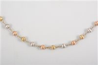 Lot 453 - A 9 carat yellow, red and white gold necklace,...