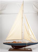 Lot 368 - A model pond yacht, integral stand, 87cm high,...