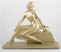 Lot 375 - An Art Deco style figure of a lady, re-gilt...