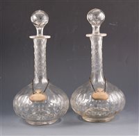 Lot 269 - A pair of slice cut decanters, 31cm, with...