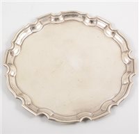 Lot 521 - A plain silver waiter with chippendale style...