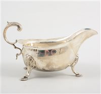 Lot 477 - A Victorian silver sauce boat, shaped edge...