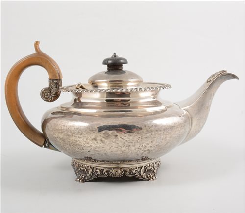 Lot 478 - George IV silver teapot, squat form, gadrooned...