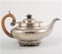 Lot 478 - George IV silver teapot, squat form, gadrooned...