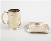 Lot 490 - A silver christening mug and ashtray, the...