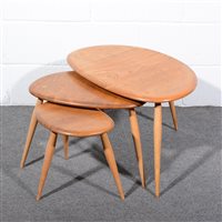 Lot 159 - Ercol, a nest of three 'Pebble' tables, shape...