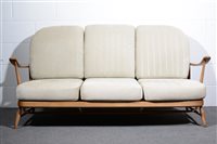 Lot 161 - Ercol, a three seater settee with matching...