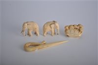 Lot 83 - A carved ivory shell with a row of turtles,...