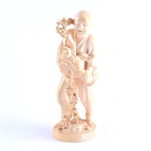 Lot 87 - A Japanese carved ivory okimono, a man and boy...