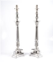 Lot 165 - A pair of modern silver-plated column table...