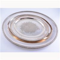 Lot 168 - Two silver-plated oval meat platters, with an...