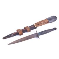 Lot 275 - Fairbairn-Sykes fighting knife, leather scabbard.