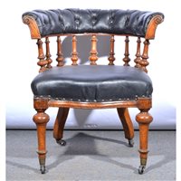 Lot 453 - An oak Captain's chair, black leather...