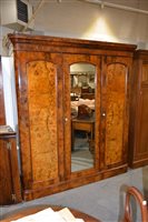 Lot 460 - Victorian walnut triple wardrobe, moulded...