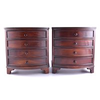 Lot 224 - A pair of miniature bow front chests, each...