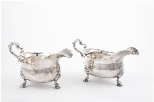 Lot 81 - Pair of George II silver sauce boats, George...