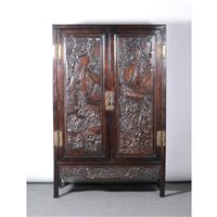 Lot 182 - Chinese hardwood cabinet, two carved panelled...