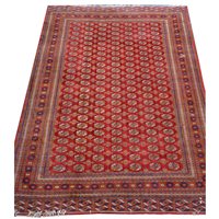 Lot 338A - A Turkoman carpet, red ground with all over...