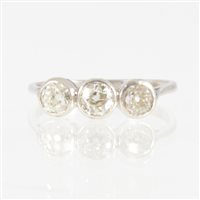 Lot 25 - A diamond three stone ring, the old brilliant...