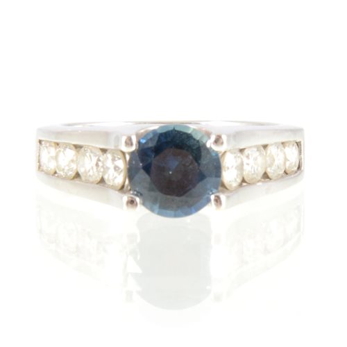 Lot 36 - A sapphire and diamond ring, the round...