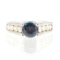 Lot 36 - A sapphire and diamond ring, the round...