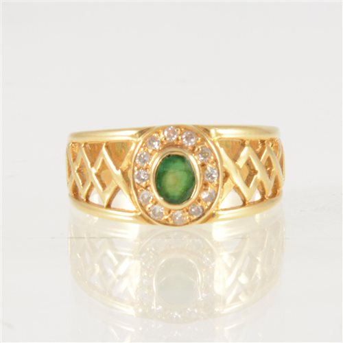 Lot 43 - An emerald and diamond dress ring, an oval...