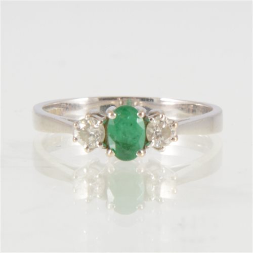 Lot 45 - An emerald and diamond three stone ring, the...