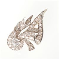 Lot 62 - A diamond set lapel brooch, the asymmetric...