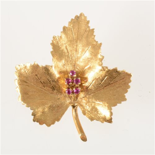 Lot 63 - An 18 carat yellow gold maple leaf brooch, the...