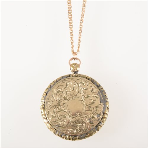 Lot 69 - A yellow metal locket and chain. a 38mm...