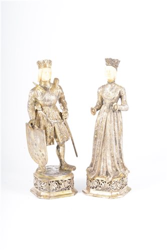 Lot 116 - A pair of German silver and ivory figures,...